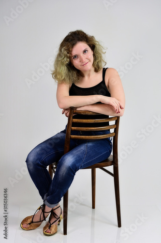 Portrait on a chair girl