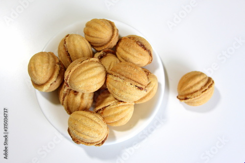 Nuts with condensed milk. Cookies. Dessert. Sweets. Dough. Bakery products. Taste of childhood.