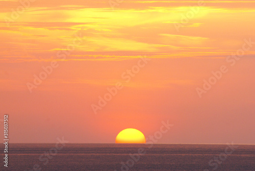 Nature landscape of Tranquil scene red sun and red sky sunset over the sea at phuket Thailand.- Red Orange Nature Backdrops Texture 