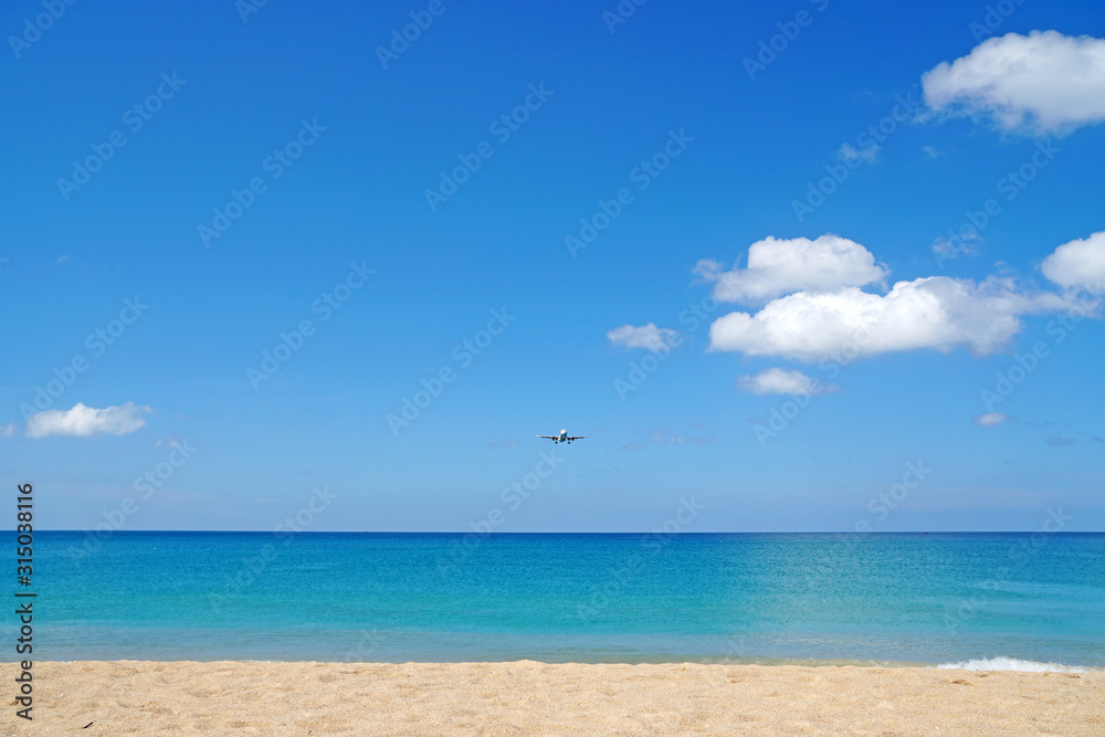 Nature seascape of Clouds blue sky and blue sea at Mai Khao beach near Phuket airport  thailand - Blue nature backdrop background with copy space text