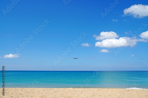 Nature seascape of Clouds blue sky and blue sea at Mai Khao beach near Phuket airport  thailand - Blue nature backdrop background with copy space text © kittinit
