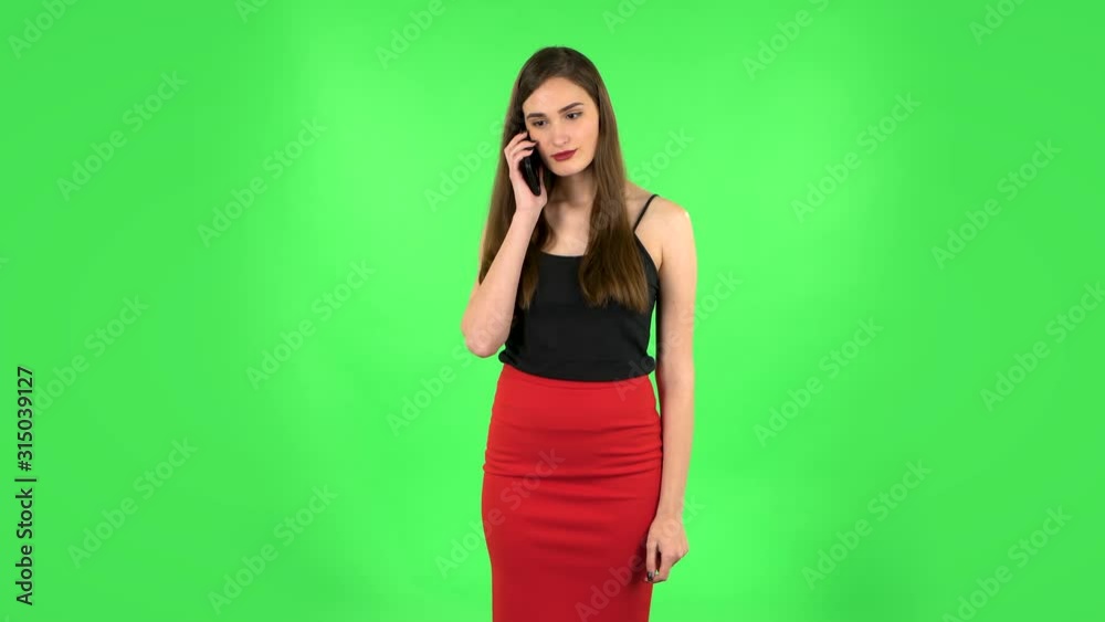 Portrait of girl talking for mobile phone. Green screen Portrait of girl talking for mobile phone. Green screen