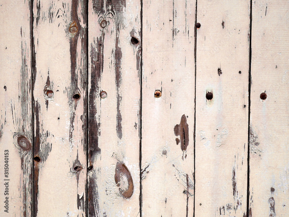 Old damaged boards texture. Wooden fence in pastel colors. Old damaged boards texture. Wooden fence in pastel colors.