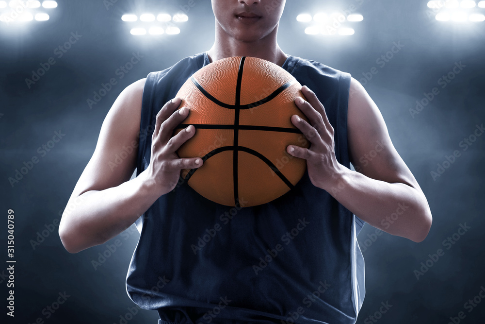 Basketball player holding a ball
