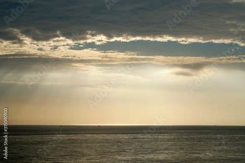 Nature seascape of Tranquil scene Light passing through the clouds on sunset over the ocean at phuket Thailand. Blue nature backdrop background with copy space text concept 