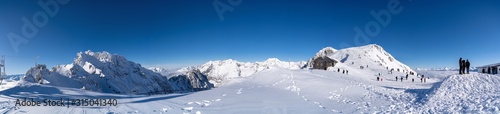 Panoramic photo of the snowy peaks of the Alps