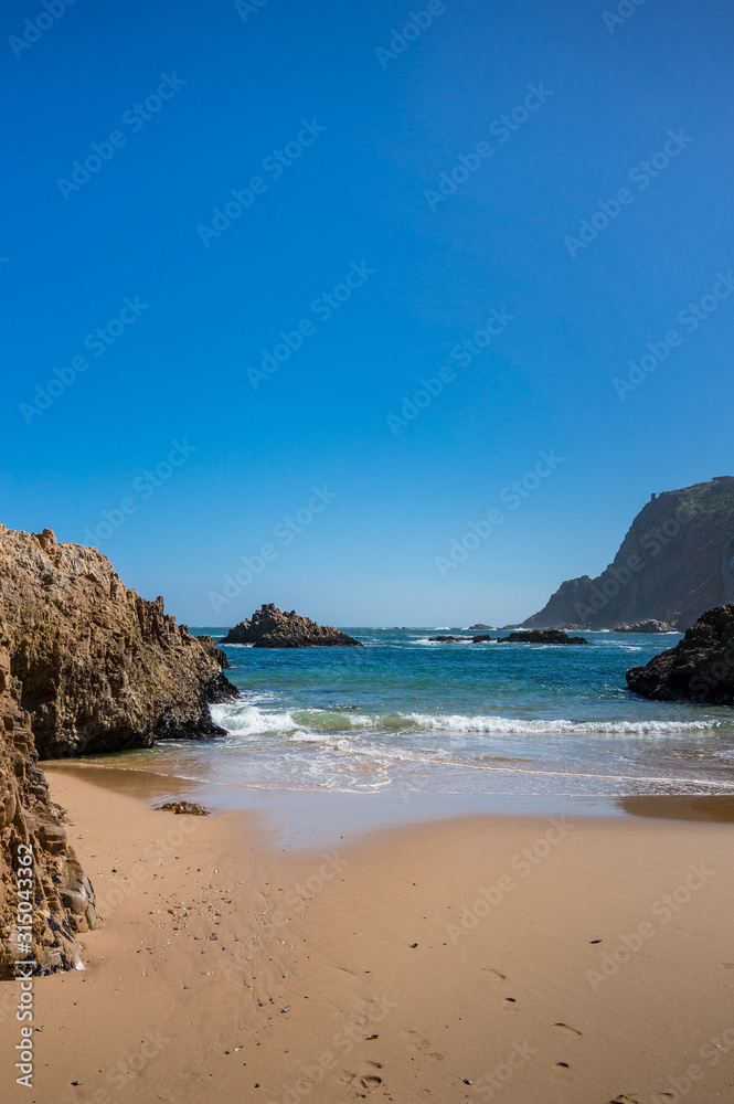 Beautiful beach with warm sand and mild waves