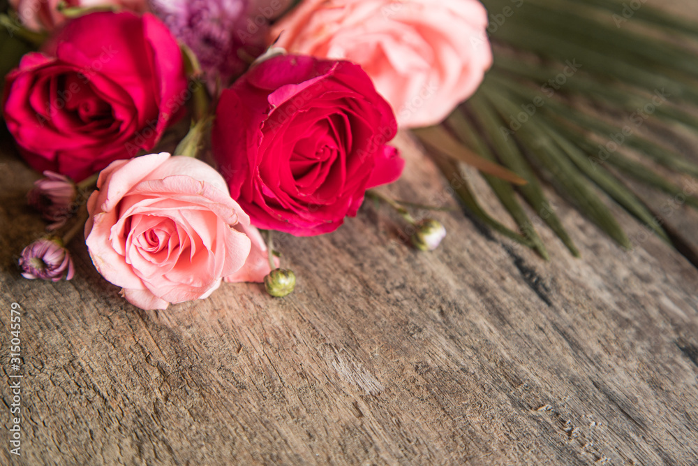 Bouquet of pink roses on a wooden background. zero waste gift on Mother's Day. Women's day card. 8 march happy womens day. copy space