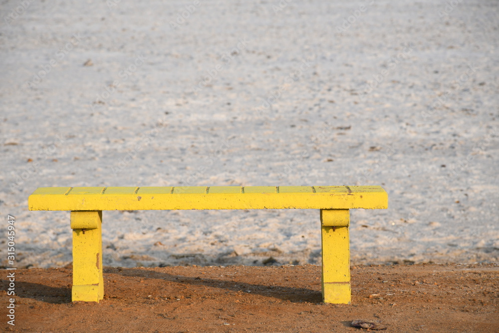 Yellow Bench for Waiting at White Dessert, White Run, Dhordo, Kutch, Gujarat, India Yellow Bench for Waiting at White Dessert, White Run, Dhordo, Kutch, Gujarat, India