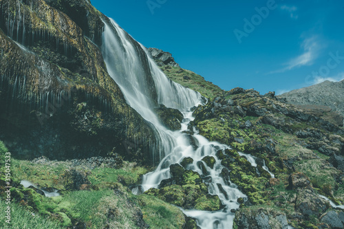 waterfall in the mountains photo