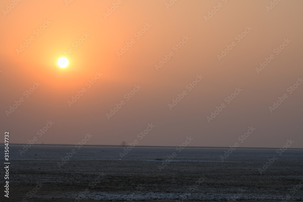 Sunset at the White dessert Dhordo, Kutch, Gujarat, India, use for background, sunset evening Sunset at the White dessert Dhordo, Kutch, Gujarat, India, use for background, sunset evening