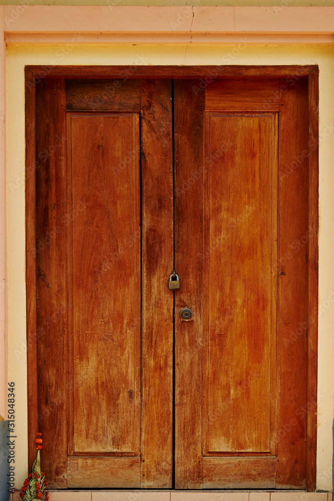 Fototapeta premium old wooden door in wall