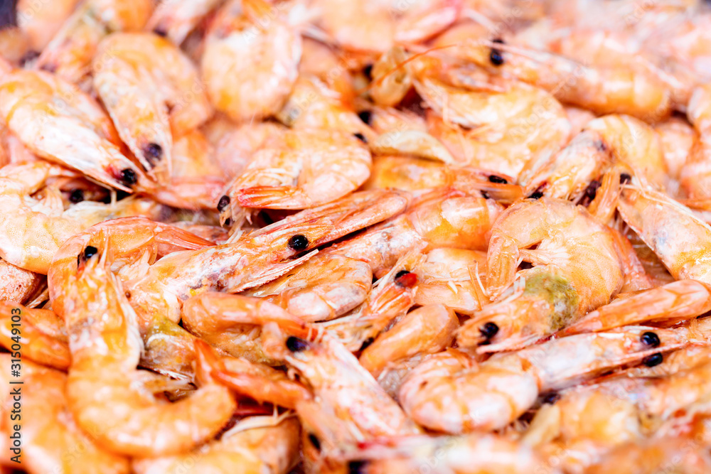 Fresh raw shrimps at market. Close up shrimps as a food background