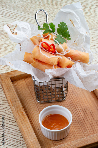 Harusame spring roll with mango chili sauce. Pan-Asian dish. photo