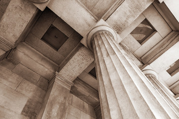 Antique stone column of a old building close-up.
