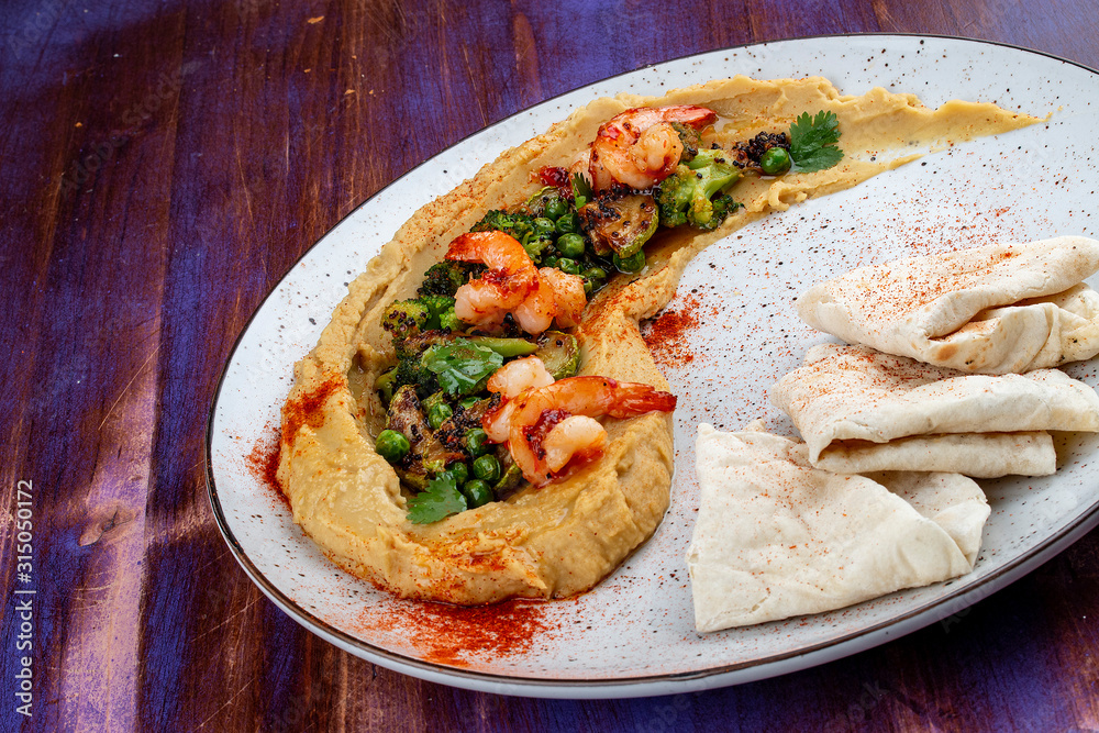 Hummus with shrimp, vegetables and homemade tortillas Hummus with shrimp, vegetables and homemade tortillas