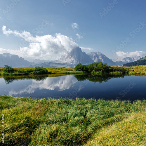 Awesome alpine highlands in summer in Dolomites Alps. Scenic image of famous Sassolungo peak. Splendid landscape in Val Gardena on a sunny day. Gorgeouse spring View of Alpine valley. Amazing summer