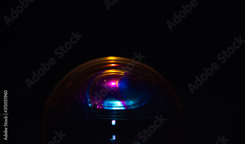 Macro of part of soap sphere on black background