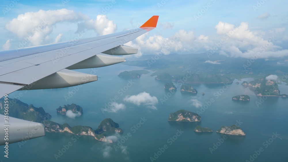 Amazing view from the porthole to the islands of Thailand when the plane approaches