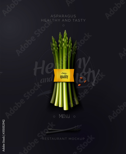 Fresh and healthy food. A bunch of asparagus on a black background. Organic food. Vector illustration of a top view.