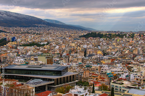 Aerial view over the city of Athens against cloudy sky. Famous touristic place and travel destination in Europe. Greece