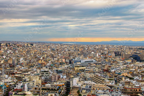 Stunning aerial view over the city of Athens against cloudy sky. Famous touristic place and travel destination in Europe. Greece