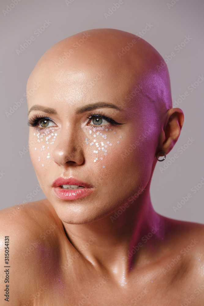 Hairless pretty woman with white paint on body and face 16519346
