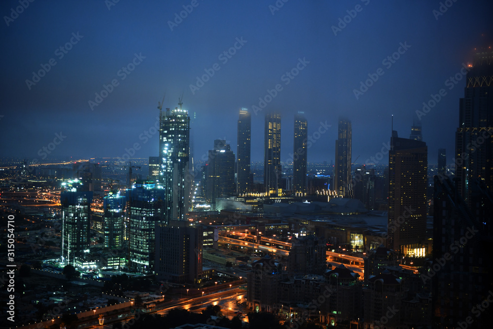 Dubai city views during heavy rains at night from the hotel window in January 2020
