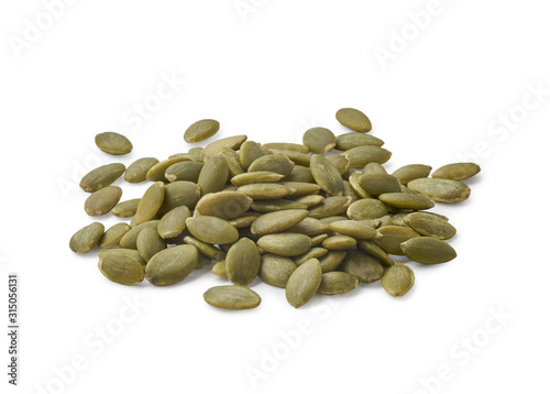 A pile of peeled pumpkin seeds isolated on white background