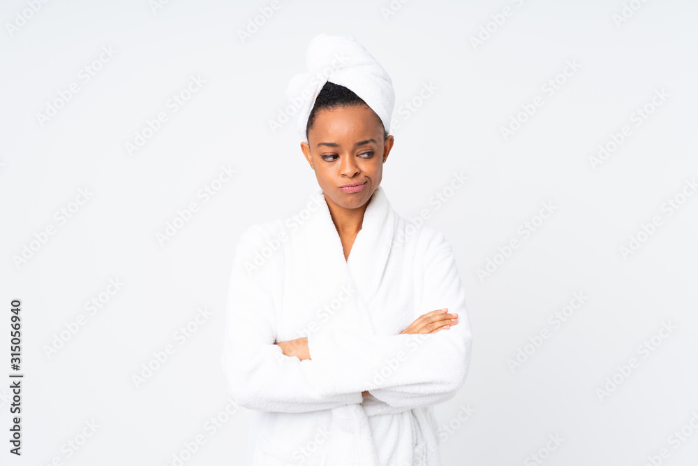 African american woman in a bathrobe over isolated background thinking an idea African american woman in a bathrobe over isolated background thinking an idea