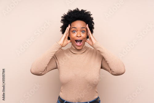 African american woman over isolated background with surprise expression