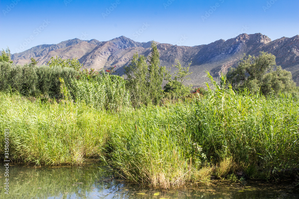 Beautiful river with mountain range in background - Keisie River in Montagu Beautiful river with mountain range in background - Keisie River in Montagu