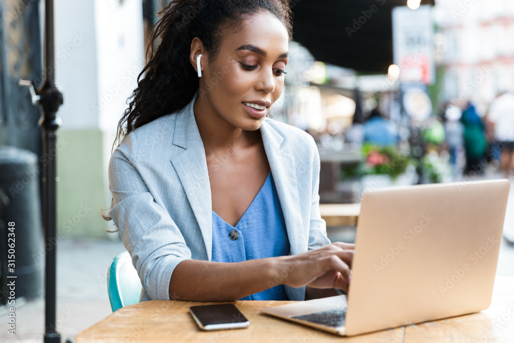 Attractive smiling young african businesswoman