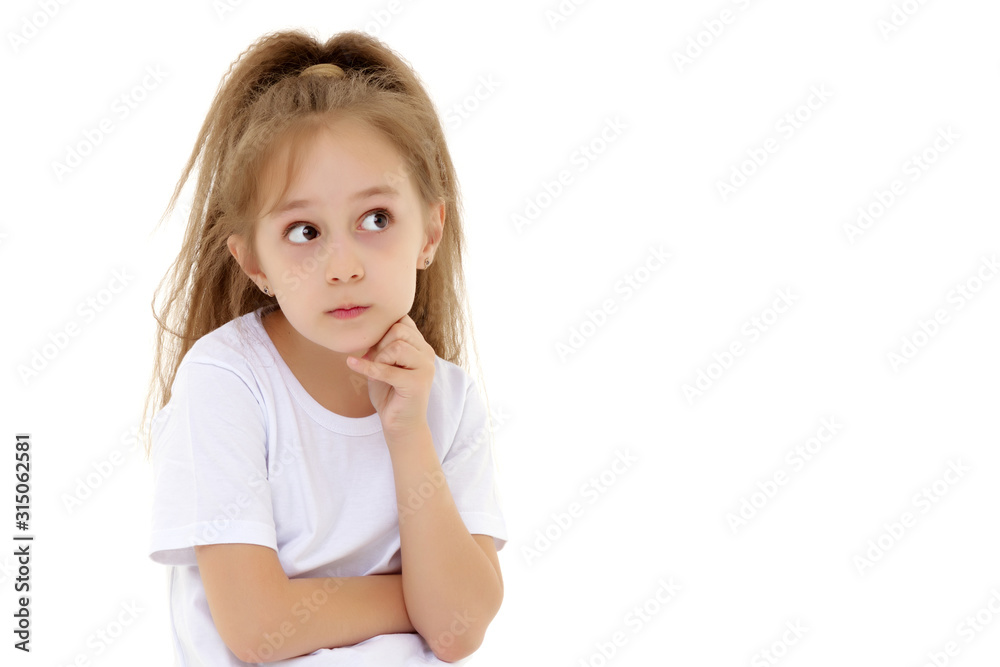 Emotional little girl in a clean white T-shirt. Emotional little girl in a clean white T-shirt.