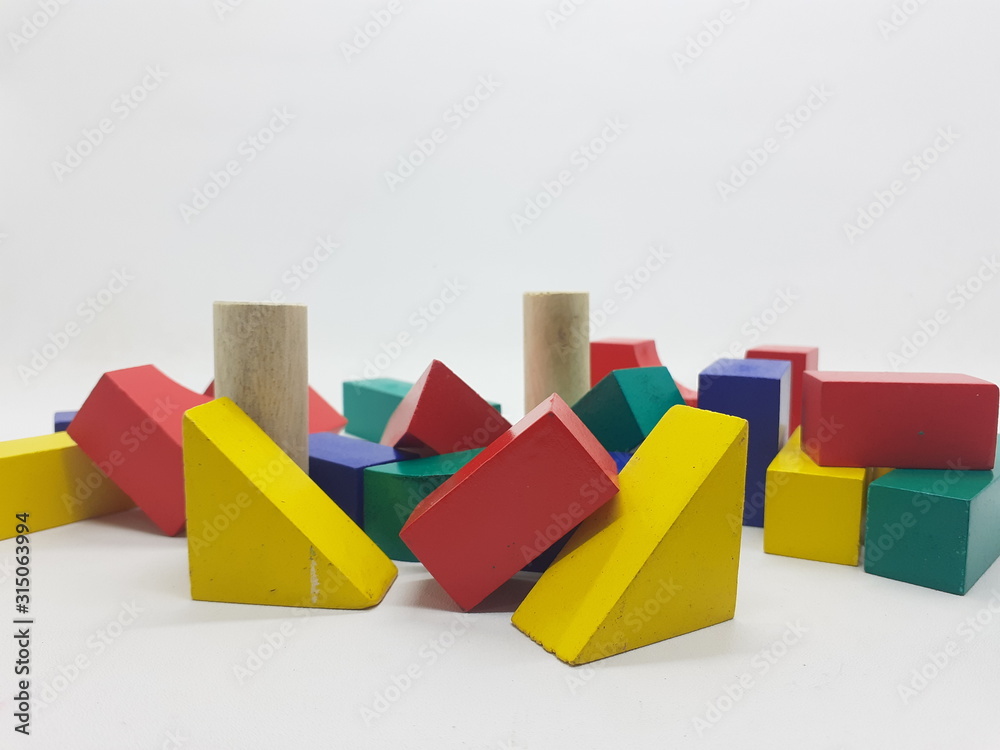 Artistic Handmade Colorful Various Shape Wooden Building Blocks Kid Toys for Playing and Creative Educational Purpose in White Isolated Background Artistic Handmade Colorful Various Shape Wooden Building Blocks Kid Toys for Playing and Creative Educational Purpose in White Isolated Background