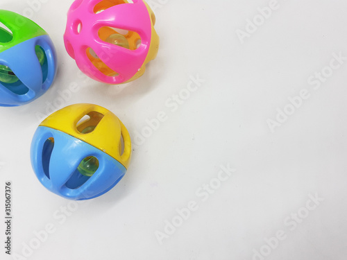 Various Colorful Cute Plastic Balls Design with Bells Ringer Sound Inside for Children or Pet Toys and Educational Purpose in White Isolated Background