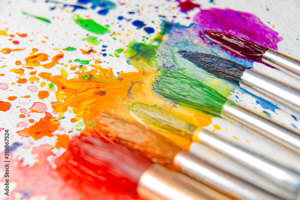 LGBTQ concept of colors made with the help of watercolor paints and brushes of azalea flowers on a sheet of paper for watercolor painting LGBTQ concept of colors made with the help of watercolor paints and brushes of azalea flowers on a sheet of paper for watercolor painting
