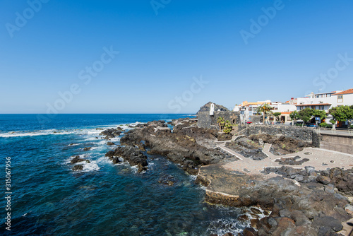 Coastal view of Garachico, small village in the north of Tenerife. Panoramic Canary Islands town background