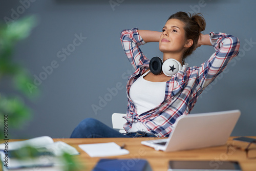 Bild auf Leinwand Female student learning at home