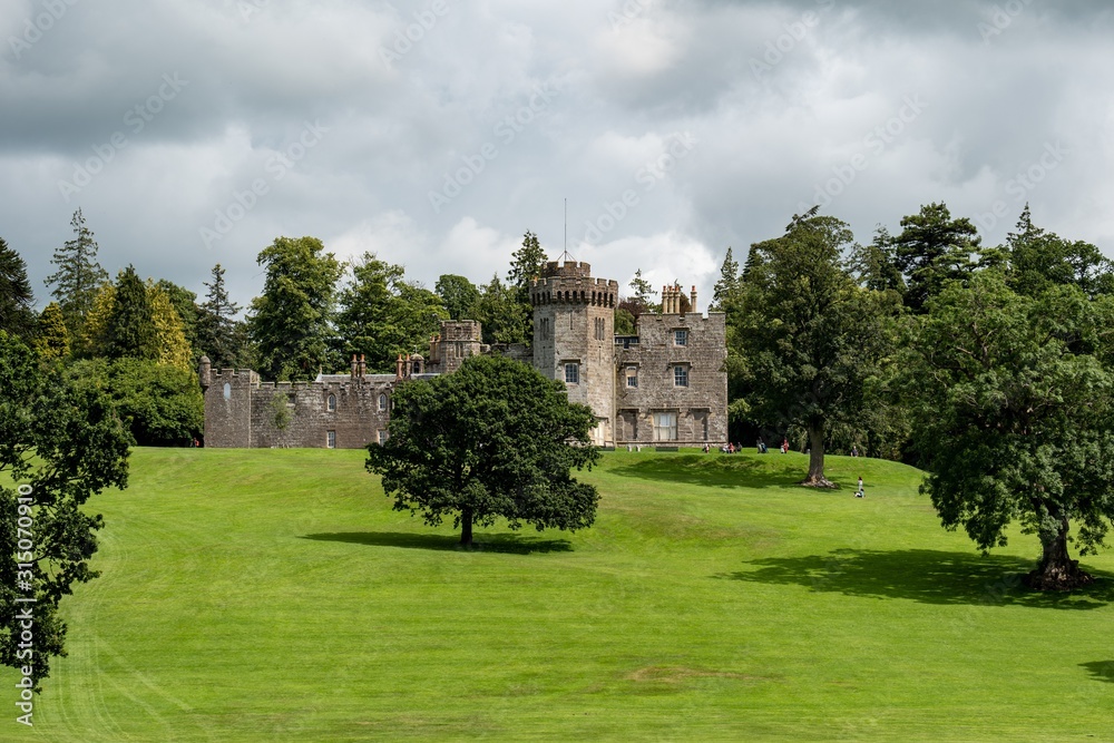 The medieval Balloch Castle in Scotland build on a hill in an early 19th century during the nice summer day