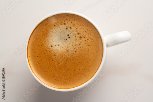cup of coffee on white background close up