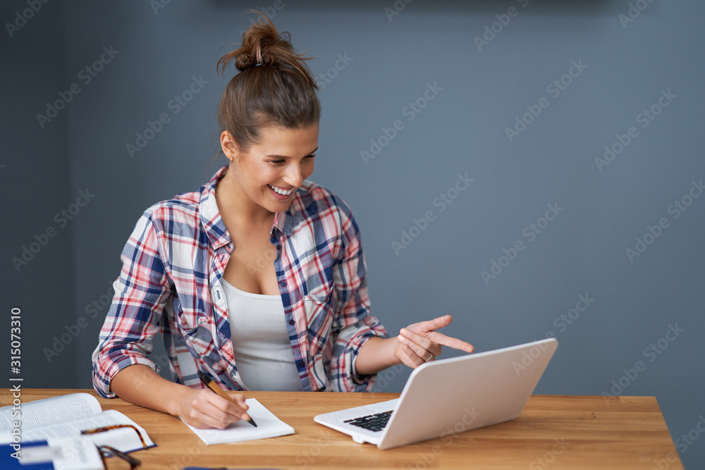 Successful female student learning at home Successful female student learning at home