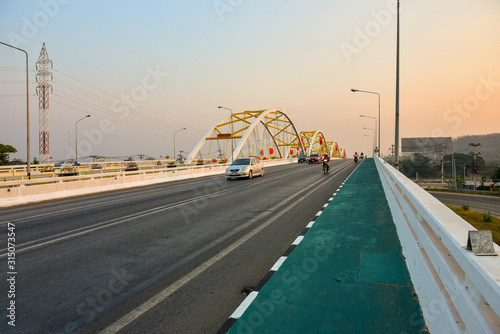 Nakhon sawan cityThailand December 30 2019 unidentified person driving on the Dechatiwong Bridge in the Chinese festival. photo