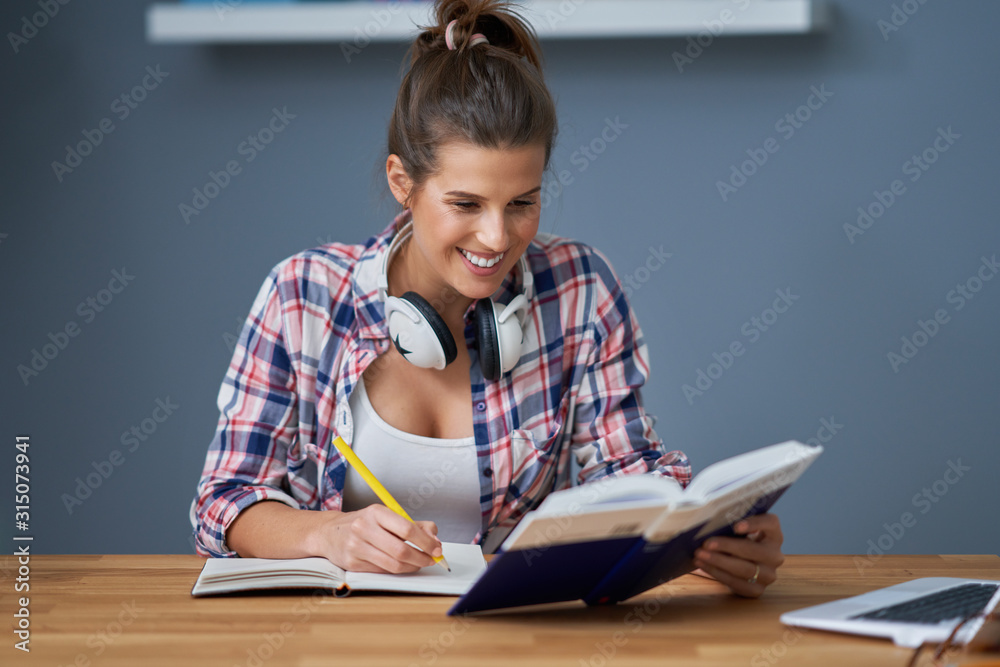 Female student learning at home Female student learning at home