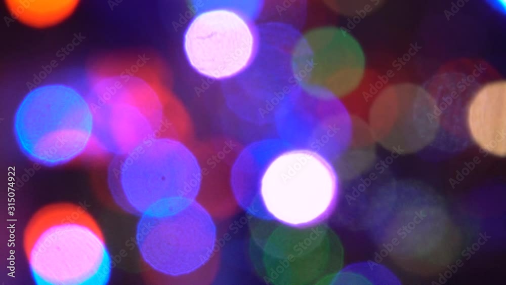 Abstract Blurred Christmas Lights Bokeh Background. Blinking Christmas Tree Lights Twinkling. Abstract Blurred Christmas Lights Bokeh Background. Blinking Christmas Tree Lights Twinkling.