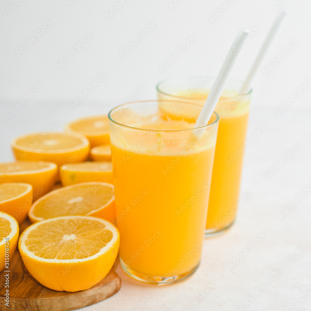 freshly squeezed orange juice and slices of orange fruit freshly squeezed orange juice and slices of orange fruit
