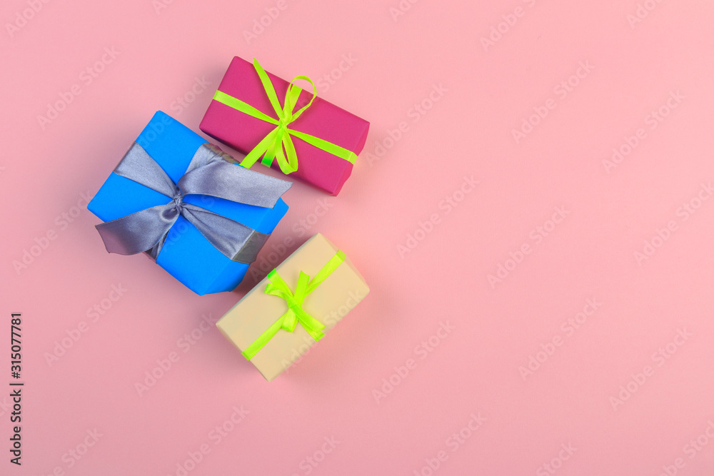 Gift box with ribbon and bow on color background and space for text. Top view - Image Gift box with ribbon and bow on color background and space for text. Top view - Image