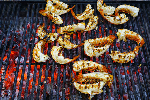 Fresh lobster tails on the grill