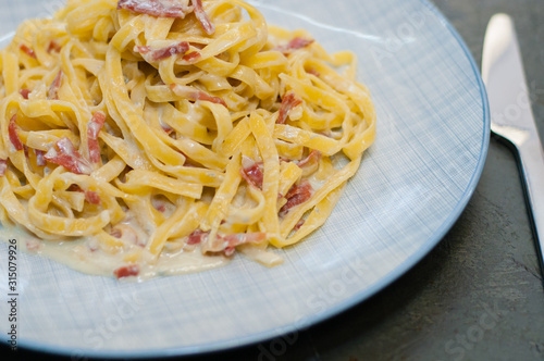 Tasty pasta with cheese and sausage. Traditional Italian cuisine