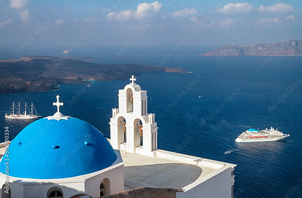 Three Bells of Fira Church is famed for its three bells, blue dome, and picturesque caldera views, Santorini, Greece.